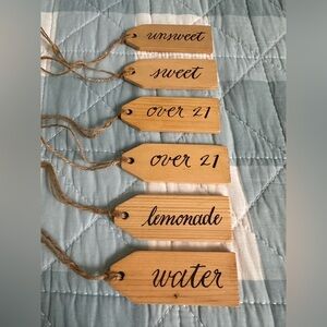 Six wooden beverage pitcher tags with burlap storage bag